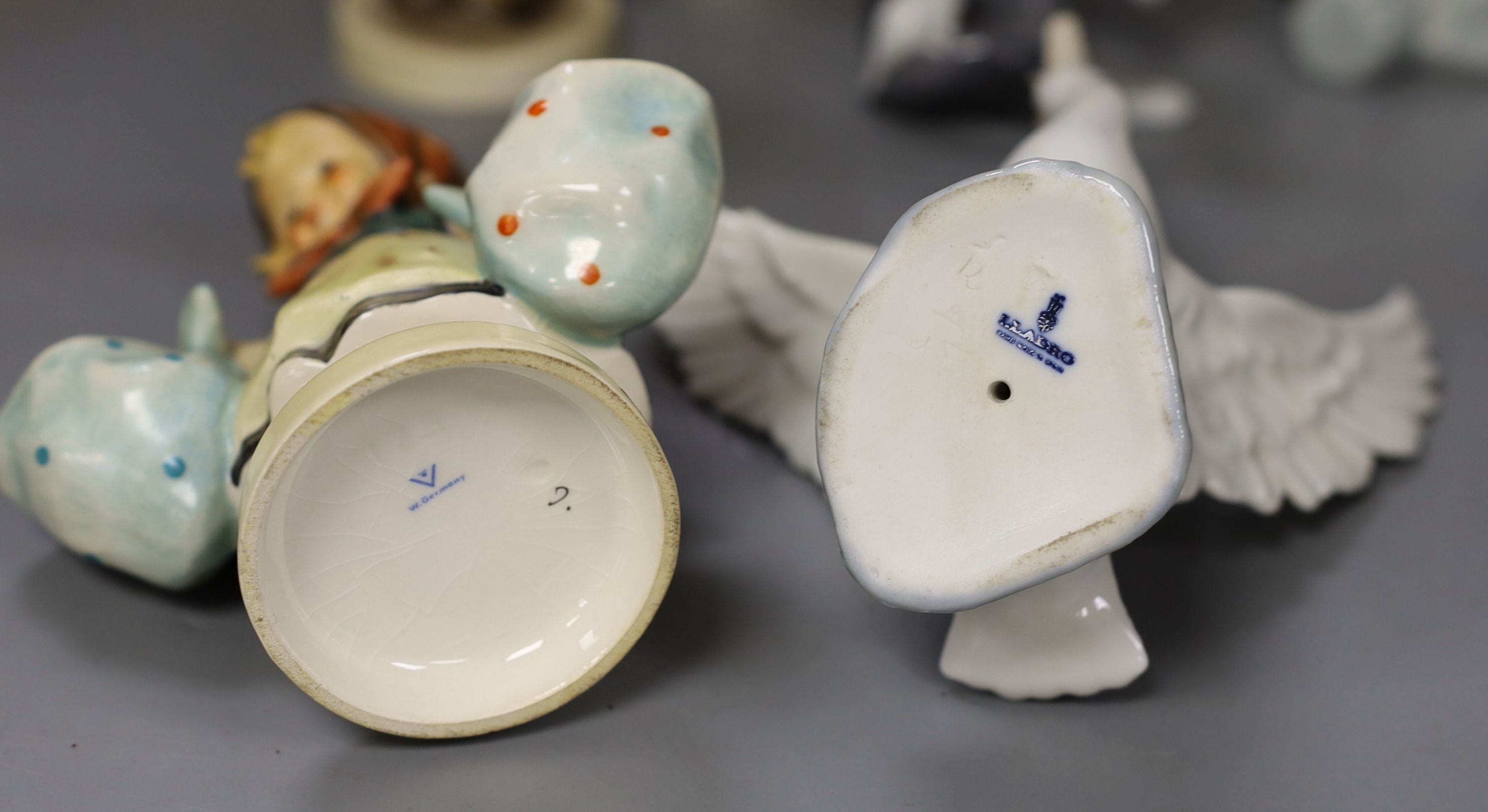 Five Hummel earthenware figures, tallest 14cm., and four Lladro animal models